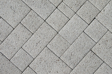 Wall Mural - gray rectangular paving stones close-up top view