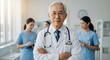 © TJ_Designs - A happy doctor in medical uniform, in a hospital with other nurses, with a little bit of blurred background with side copy space, with background sunshine