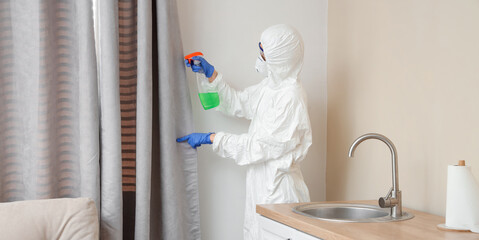 Wall Mural - Female worker of cleaning service removing mold from curtain in kitchen