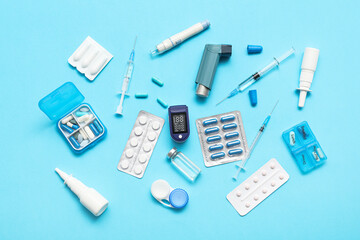 Wall Mural - Composition with pulse oximeter and different medicines on blue background