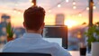 © FutureLens - Overwhelmed consultant facing burnout at sunset in modern office