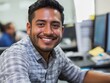 © setiadio - Smiling man in a modern office setting, engaged with coworkers nearby