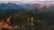 © EVERST - Couple hiking in mountains of Norway aerial view friends adventurers man and woman climbing, active summer vacations healthy lifestyle extreme trip outdoor family trekking in Lyngen Alps