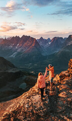 Wall Mural - couple climbing mountains in norway man and woman traveling active vacations healthy lifestyle outdo