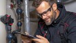 © Anna - technician in safety glasses closely inspects a water meter while recording observations on a clipboard