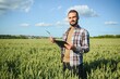 © Serhii - Portrait of farmer standing in wheat field