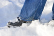 © Виталина Митрофанова - winter-themed close-up person standing in the snow blue jeans black shoes snow sticking to the shoes winter fashion footwear activities walking outdoor adventures resilience travel cold seasonal legs