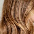 © CybStars - Close-up of beautifully styled wavy blonde hair, showcasing vibrant color and sheen, perfect for beauty, fashion, or hair care themes.
