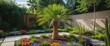 © The 2R Artificiality - Lush garden landscape showcasing a small green palm tree surrounded by vibrant flowerbeds on a sunny day. Ideal for outdoor design themes.