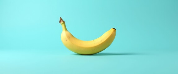 Wall Mural - Fresh Organic Banana on Bright Blue Background Minimalistic Tropical Fruit Concept Creative Arrangement with Copy Space for Summer Themes