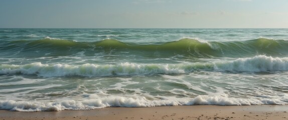 Wall Mural - Gentle Green Waves Lapping On Sandy Shore With Clear Sky Above In Serene Coastal Landscape