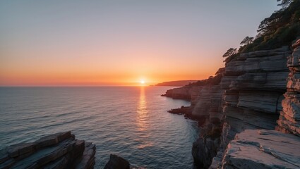 Wall Mural - Tranquil Sunset Over Rocky Coastline With Ocean Reflections And Space For Text