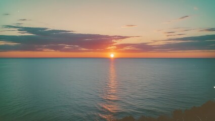 Wall Mural - Scenic Sunset Panorama Over Calm Ocean Waters With Vibrant Sky and Space for Text Embellishment