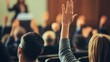 © MyStockz - Engaged Audience with Raised Hands in a Conference Setting