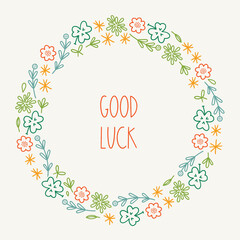  St. Patrick's Day greeting card with flowers, leaves, clover, stars on white background. Perfect for season holidays and decorations. Hand drawn outline frame, wreath