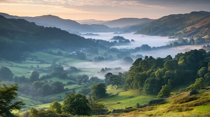 Wall Mural - a gentle blur effect of a mountain landscape with mist rising from the valley, evoking a peaceful mo