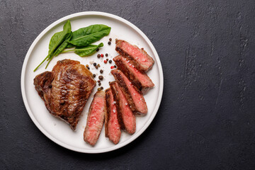 Wall Mural - A perfectly cooked sliced striploin steak with a juicy, tender texture