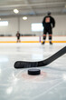 © Fabio - Close up of ice hockey stick on ice rink in position to hit hockey puck