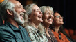 © alexandr - a group of senior friends smiling and laughing while enjoying a live theater performance in a warmly lit intimate setting