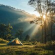 © Nurul - Sunrise campsite in mountains, tranquil scene, perfect for travel brochure or outdoor ad