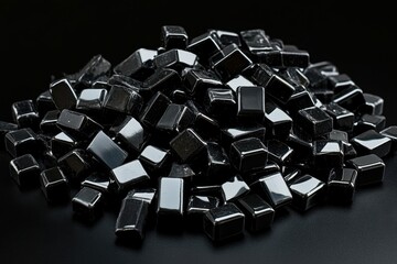 Poster - Pile of shiny black cubes on a dark surface