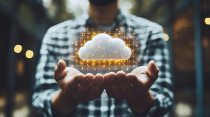 Poster - Businessman holding a cloud computing icon made of lights in his hands, concept of cloud computing and technology