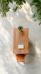 Poster - Scandinavian Office Setup Aerial View of Wooden Desk with Digital Tablet and Greenery - Modern Workplace Aesthetic for Eco-Friendly Business Environments