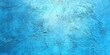 © Paul - Light blue grunge wall texture with a rough finish.
