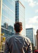 © Pixel Diversity - Spain barcelona rear view of a young businessman looking at office block in the city skyscraper city building skyscraper downtown business architecture cityscape