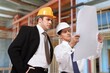 © BillionPhotos.com - Construction Engineering worker discusses plan the building
