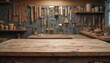 © Maryna - Rustic wooden table in carpenter workshop with wall of blurred woodworking hand tools. Empty workbench surface for carpentry product presentation, mockups, background. Woodcraft DIY, home renovation