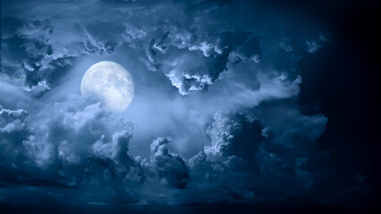 Wall Mural - night sky with moon light. dramatic clouds in mystic moonlight. large bright moon as concept of myst