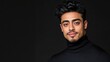 © Raul - Portrait of a young Hispanic man with dark hair and eyes, wearing a black turtleneck sweater against a black background.  A sophisticated and stylish image.