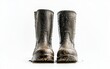 © Stanislau - Muddied work boots stand prominently on a white background after a long day of outdoor activities