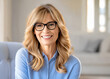 © Anja - woman best ager baby boomer with glasses and long blonde hair