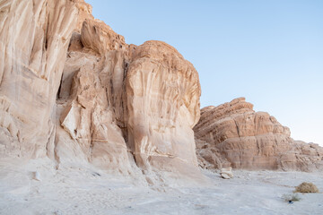 Aufkleber - Natural rock formations rise gracefully against the clear sky in Sinai desert, Egypt during early morning light