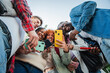 © Jose Calsina - A joyful group of diverse student friends smiling while interacting with their cellphones, capturing moments, sharing laughter, and bonding through technology, emphasizing connection and friendship