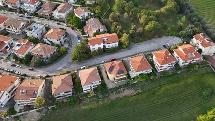 Aerial photo of houses, roofs, streets and greenery and a beautiful view in the Italian town of Roseto degli Abruzzi in the province of Teramo.

