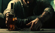 © Uladzislau - Addicted man in handcuffs with bottle of alcoholic drink at table against blurred background, closeup