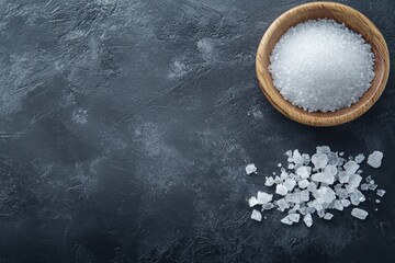 Wall Mural - Sea salt crystals in a wooden bowl and scattered