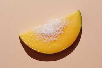 Wall Mural - Mango slice covered with coarse salt on a solid background