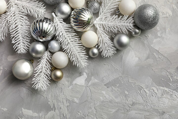 Canvas Print - Christmas balls and fir branches on grey background