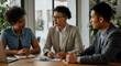 © Postmodern Studio - Three people are sitting at a table, discussing something