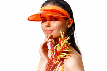 Poster - Bright summer portrait of a smiling model with a visor and tropical flowers in vibrant colors, celebrating summer emotions and style.