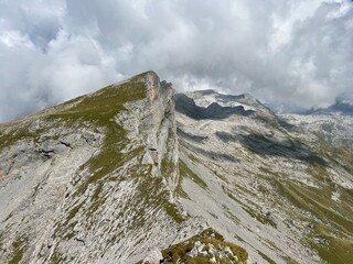 Wall Mural - Rocky alpine peaks above Lake Melchsee or Melch Lake in the Uri Alps mountain massif, Kerns - Canton of Obwalden, Switzerland (Kanton Obwald, Schweiz)