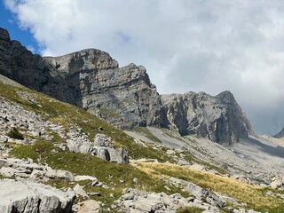 Wall Mural - Rocky alpine peaks above Lake Melchsee or Melch Lake in the Uri Alps mountain massif, Kerns - Canton of Obwalden, Switzerland (Kanton Obwald, Schweiz)