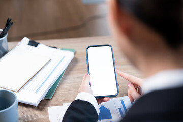 Wall Mural - top view woman sitting and holding blank screen mock up mobile phone
