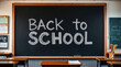 © adynue - Black chalkboard in the classroom with the words back to school