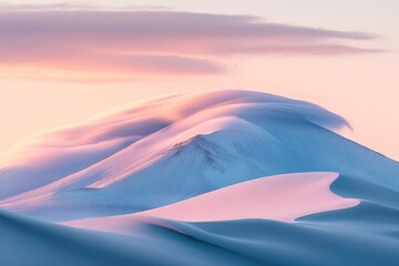 Wall Mural - Pastel sunset hues paint a serene landscape of snow-covered mountains and gently flowing clouds.