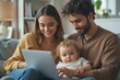© indofootage - Young man working from home and his wife taking care child in the sofa on blurry background with copy space